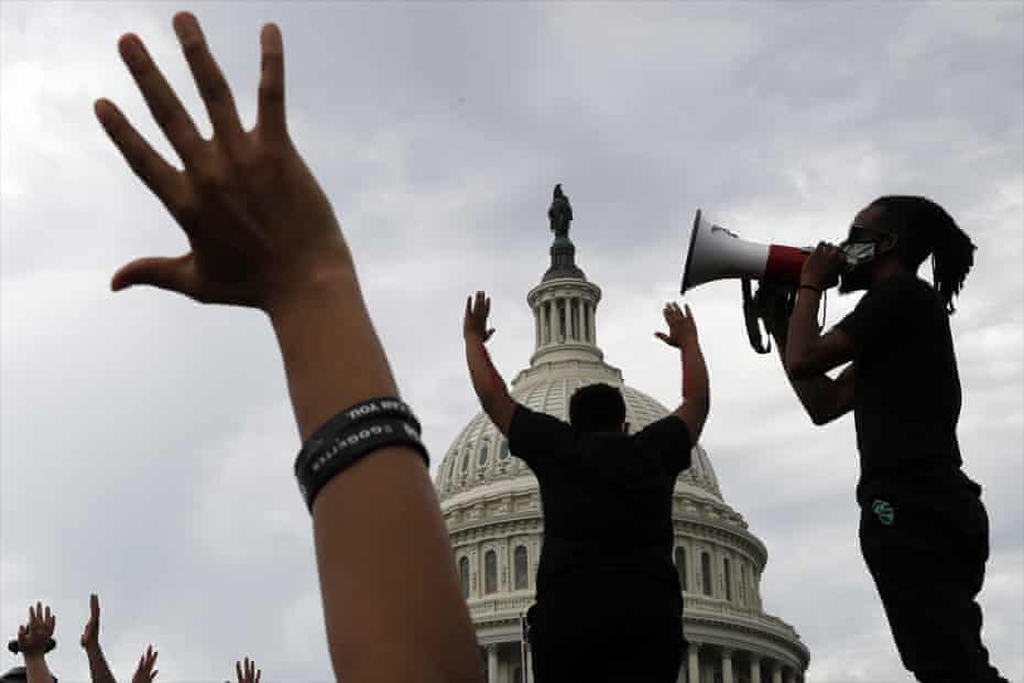 Demonstrators protest the death of George Floyd as they gather on the East side of the US Capitol in Washington on 3 June 2020.