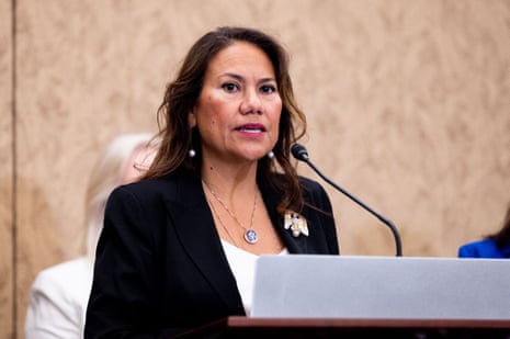 a woman speaks into a microphone