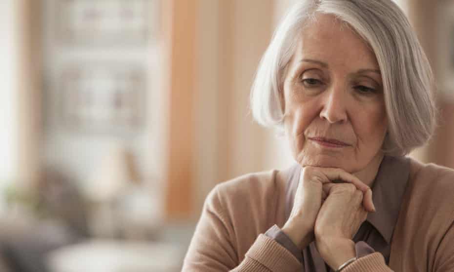 Senior Caucasian woman with chin in hands