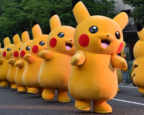 A line of Pokémon Pikachu characters parade in Yokohama, Japan.