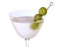 Legareâs bay leaf martini with olives in a glass.