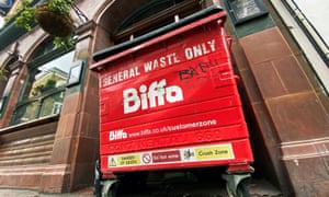 The logo of waste management company Biffa is seen on a large wheelie bin outside a pub in London.