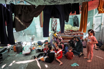 Displaced families, who returned from Khan Yunis in the southern Gaza Strip to the north take shelter at Al-Shifa hospital in Gaza City