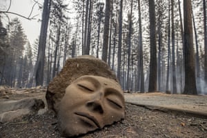 A sculpture rests in front of a Grizzly Flats home destroyed by the Caldor fire.