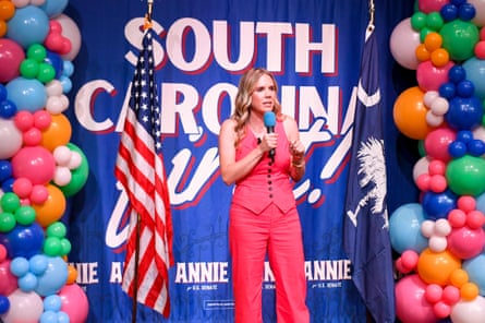 a woman speaks into a microphone