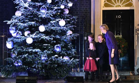 Theresa May is joined by schoolchildren to turn on the Christmas lights outside No 10