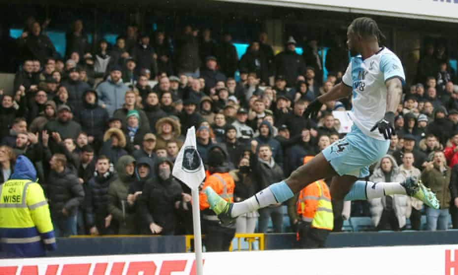 Jean-Philippe Mateta celebrates in front of the unimpressed Millwall fans at the Den