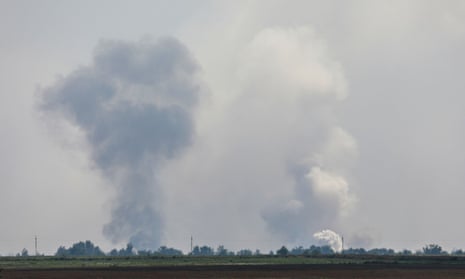Smoke rises after an alleged explosion in the village of Mayskoye in Crimea.