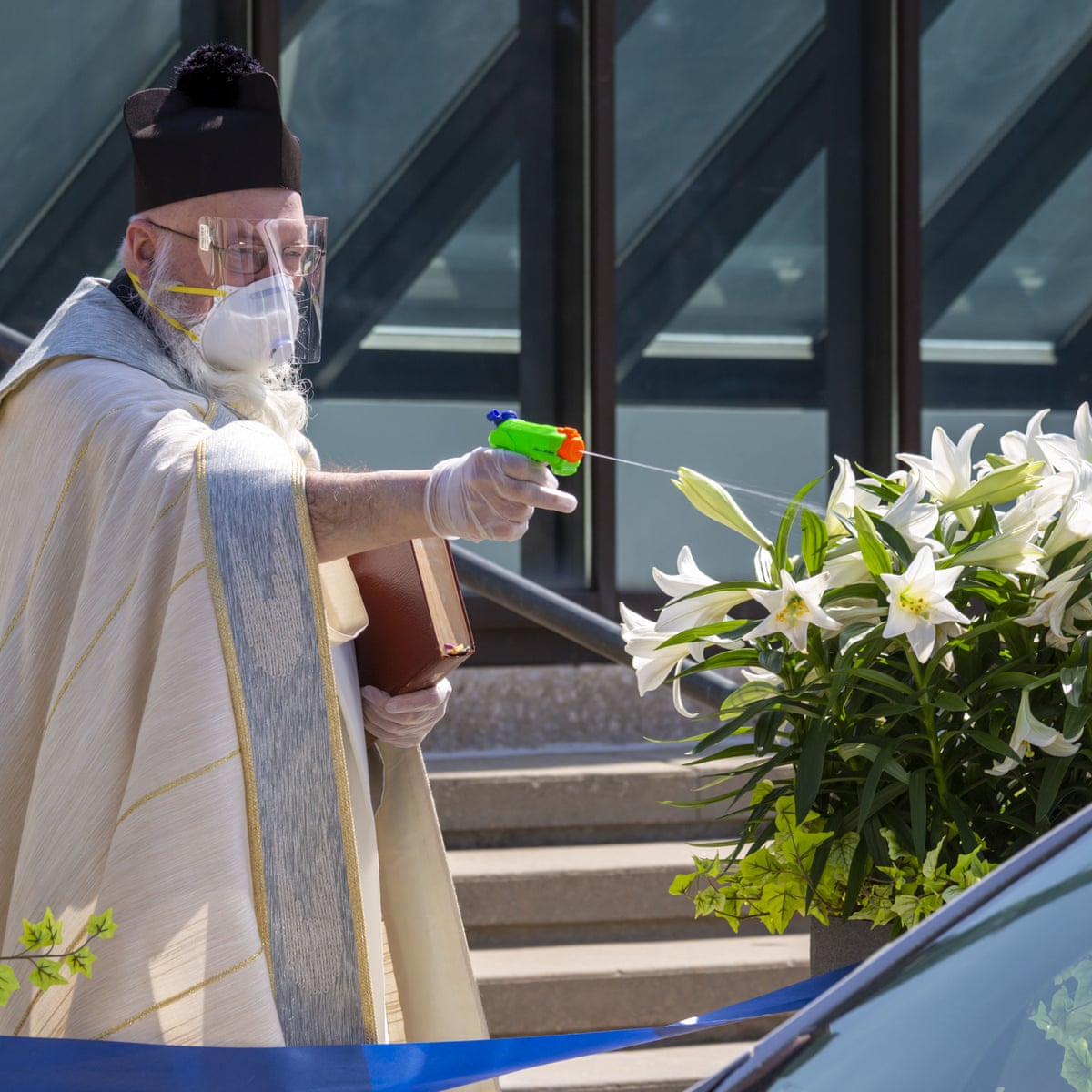Detroit Priest Sprays Holy Water From Squirt Gun To Maintain Social Distancing World News The Guardian