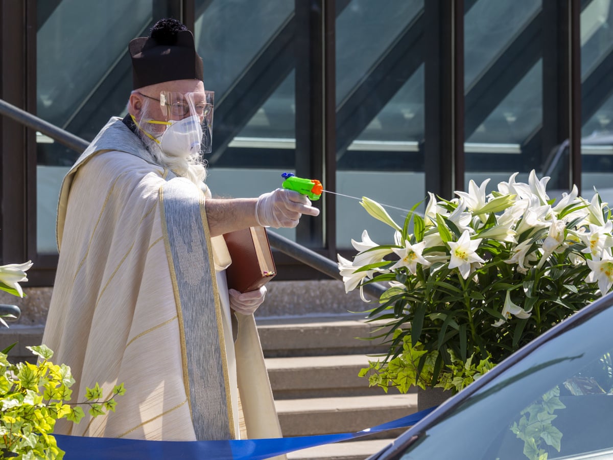 Detroit Priest Sprays Holy Water From Squirt Gun To Maintain Social Distancing World News The Guardian