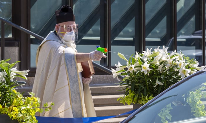 Holy Water Drive-Through: Priest Uses Squirt Gun To Bless Devotees