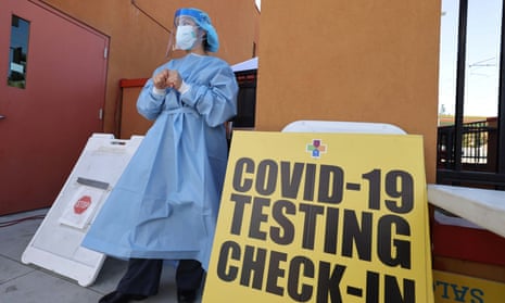 Registered nurse Glenda Perez waits to test people for coronavirus at a location in east Los Angeles.