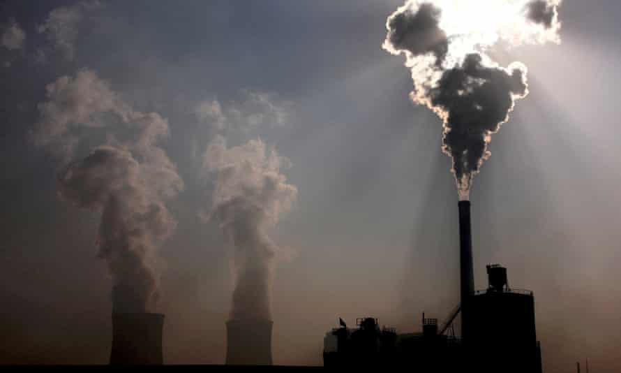 A coal-burning power plant behind a factory in China's Inner Mongolia autonomous region.