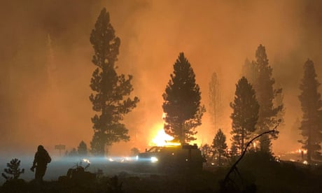 Firefighter tackle the Bootleg fire, near Klamath Falls, Oregon on 17 July.