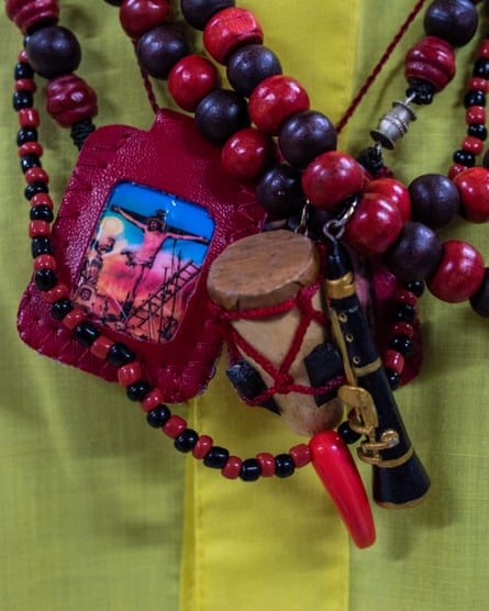 A rosary with religious symbols and a tabor and flute