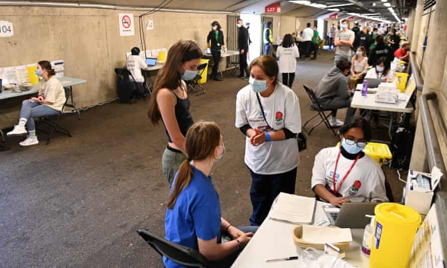 Young people wait to receive vaccinations