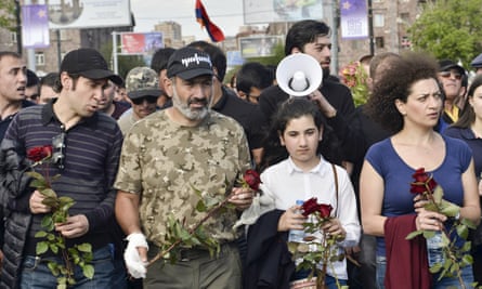 Armenian opposition leader Nikol Pashinyan, second left, leads a march to attend a memorial service at the monument to the victims of the Armenian genocide.