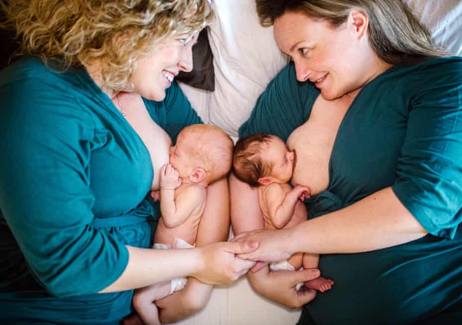 Jaclyn (left) and Kelly Pfeiffer breastfeeding their babies after Jaclyn used the induced lactation process.