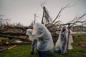 The McKnight family gather belongings from the wreckage of their home as Mississippi braces for another round of potentially severe weather after thunderstorms spawning high straight-line winds and tornadoes ripped across the state in Rolling Fork, Mississippi, US
