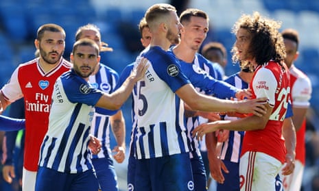 Brighton’s Neal Maupay is shielded from Arsenal’s Matteo Guendouzi after the final whistle