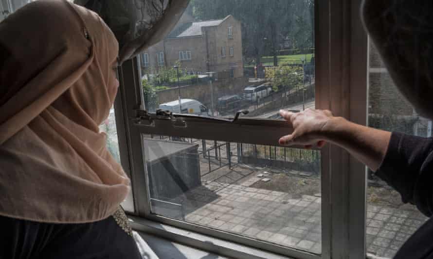Khayrun Begum looks out of the window of Sophie Spielman's flat in Treves House.