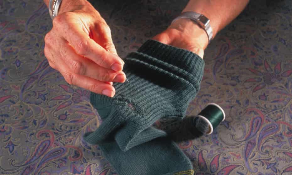 Woman darning socks