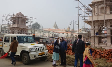 People take photos of themselves at the Ram Mandir temple complex 