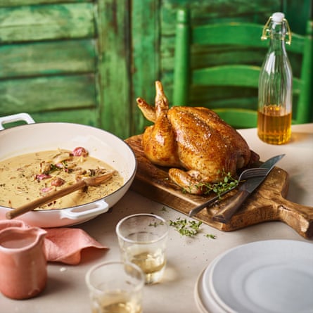 Whole roast chicken with garlic cloves and wild mushroom gravy