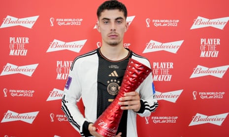Kai Havertz of Germany looks anything but thrilled as he poses with the Player of the Match trophy.