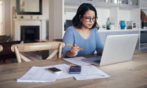 Young woman using a laptop while working from home