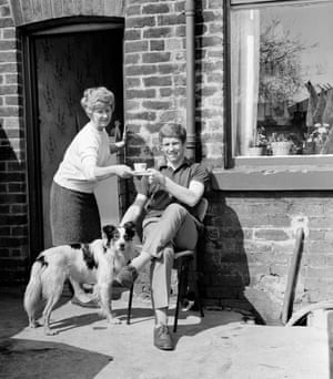 Everton and England’s Alan Ball has a cup of tea outside his childhood home with his mother, Violet and her dog less than a year after England’s World Cup triumph.