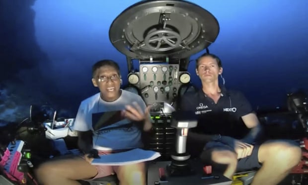Danny Faure (left) speaking from inside the submersible