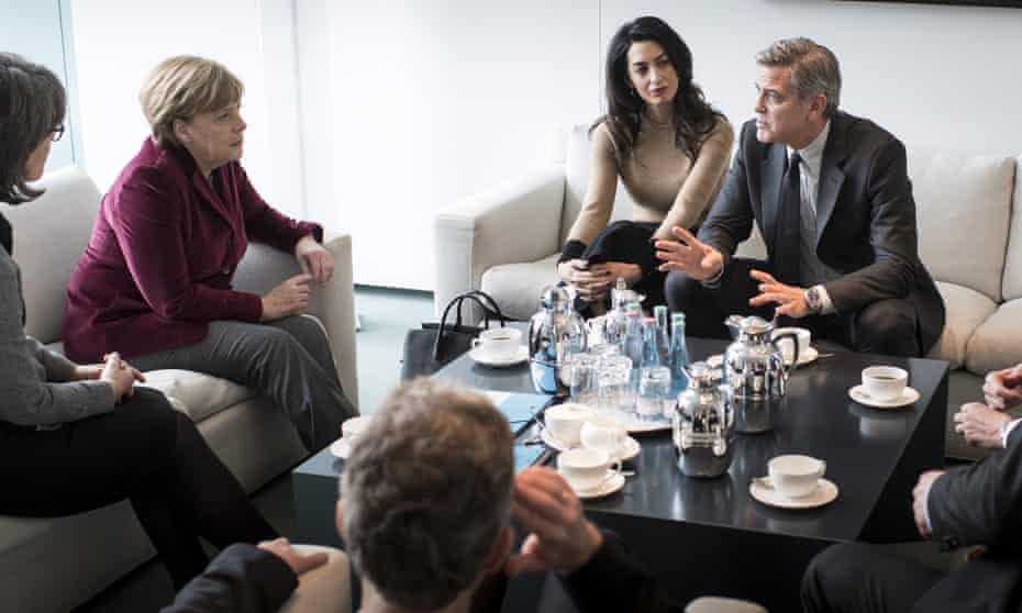 George and Amal Clooney meet Angela Merkel at the Federal Chancellery in Berlin.