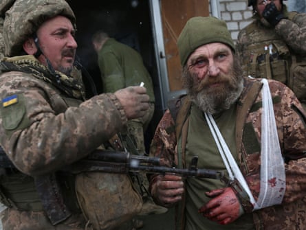 A wounded Ukrainian serviceman after a battle with Russian troops and Russia-backed separatists in Luhansk region in March.