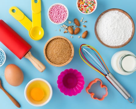 An overhead image of kitchen supplies alongside baking ingredients