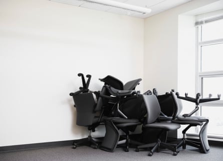 Office chairs piled up in a corner