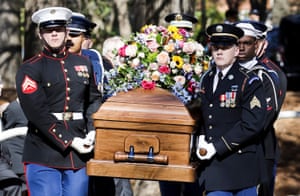A military honor guard brings the coffin of Carter from the Jimmy Carter Presidential Library in Atlanta, Georgia, on 28 November