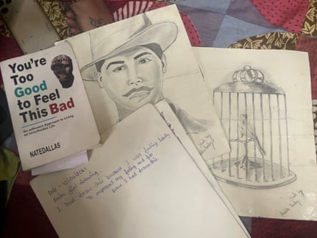 Sketches made by Anshika Pandey; and a book she was reading at the time of her death.