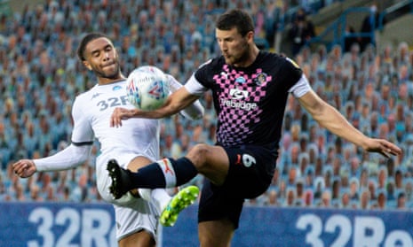 Leeds’ Tyler Roberts (left) battles with Luton’s Matty Pearson during their Championship match on Tuesday.