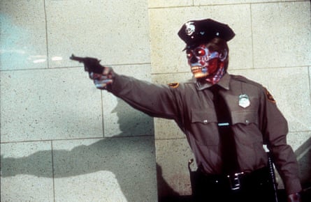 A man successful constabulary azygous pinch a skull for illustration look intends a gun