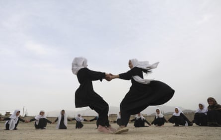 Afghan girls play in a primary school playground in Kabul in March. Schools have only recently begun reopening.