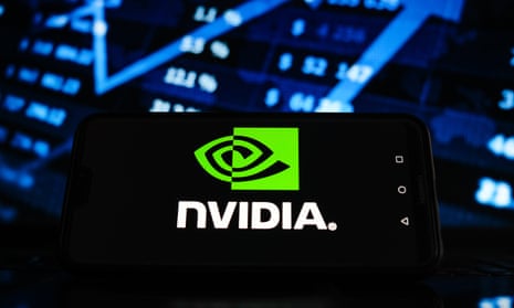 Photo illustration of a Nvidia logo displayed on a smartphone screen with stock market graphic in the background.