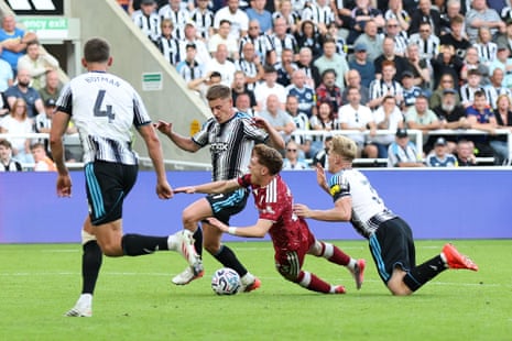 Victor Munoz of Liverpool is fouled by Lewis Hall of Newcastle United leading to a penalty.