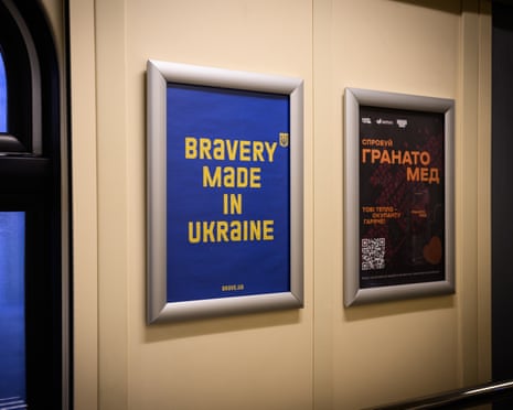 A sign reading “Bravery Made in Ukraine” is displayed in a train corridor in Ukraine.