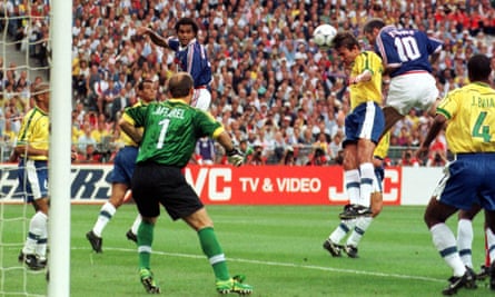 Zinedine Zidane leaps to head France’s opening goal past the Brazil goalkeeper Claudio Taffarel.