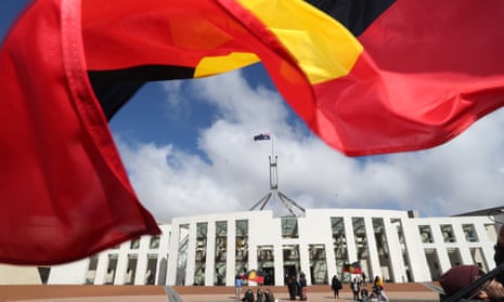 Aboriginal flag with Parliament House in the background