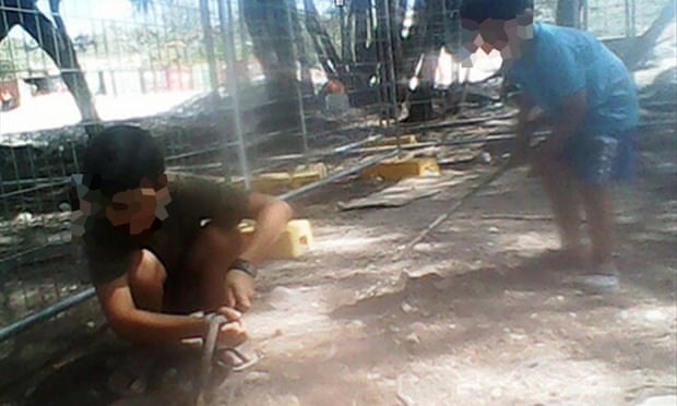 Asylum seeker children play in the dirt at the Australian-run immigration detention centre on Nauru.