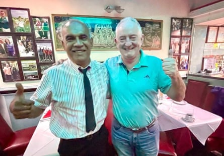 Mohammed Ayub Qureshi pinch nan main executive of World Bowls, Neil Dalrymple, astatine his curry location successful Glasgow.