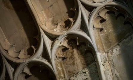In the Norman Porch, intricate fan vaulting is flaking away, damaged by seeping rainwater and leaking pipes.