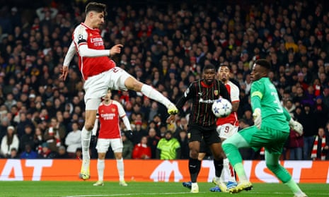 Arsenal’s Kai Havertz scores their first goal past Lens’ goalkeeper Brice Samba.
